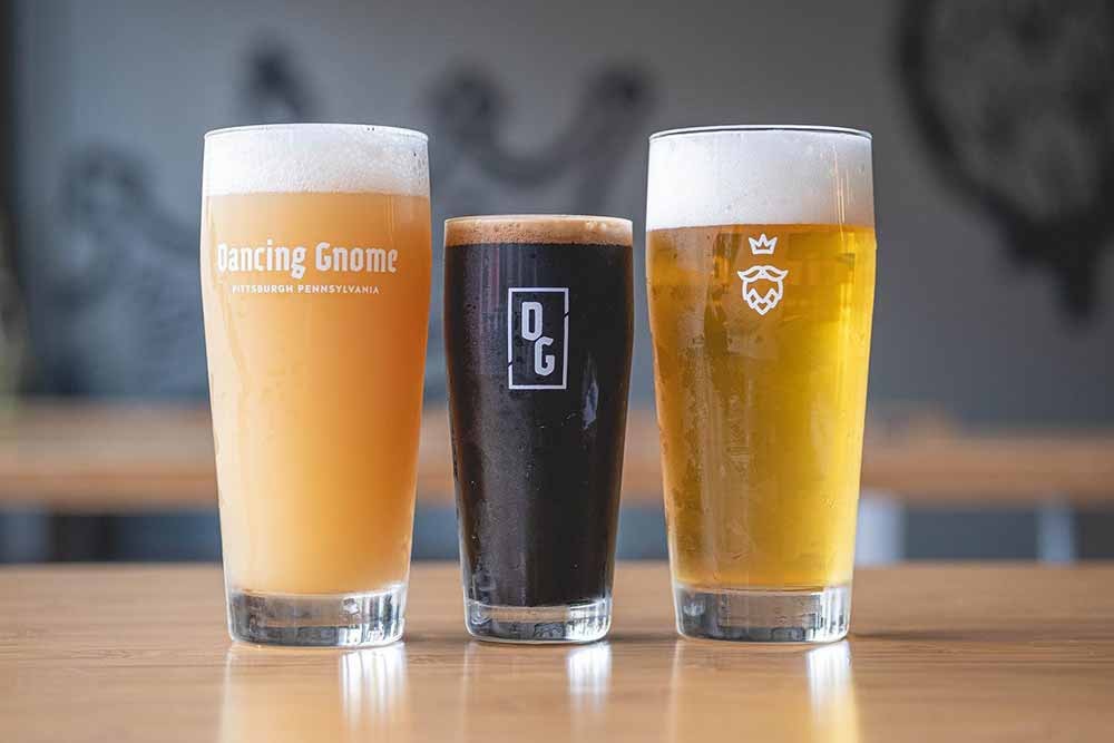 Dancing Gnome Brewery Pittsburgh — three craft beers in branded glassware