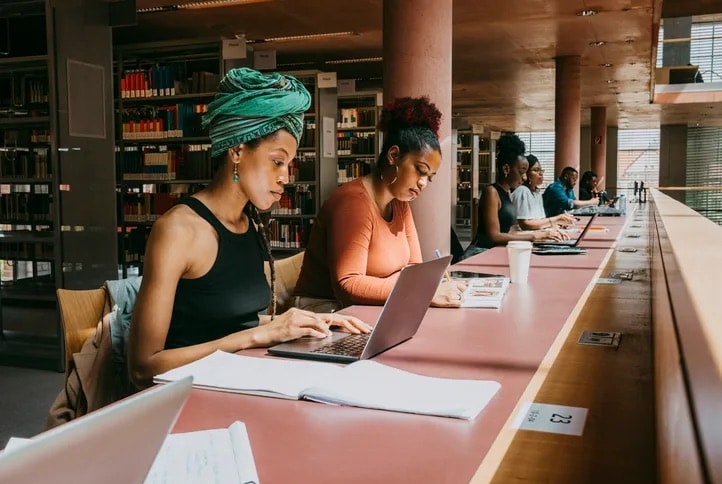 Students studying together in a university library