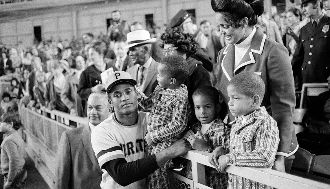Roberto Clemente with his wife Vera and their sons at a Pirates stadium event
