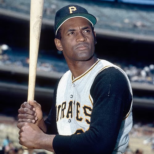Roberto Clemente in his Pittsburgh Pirates uniform holding a bat — color portrait