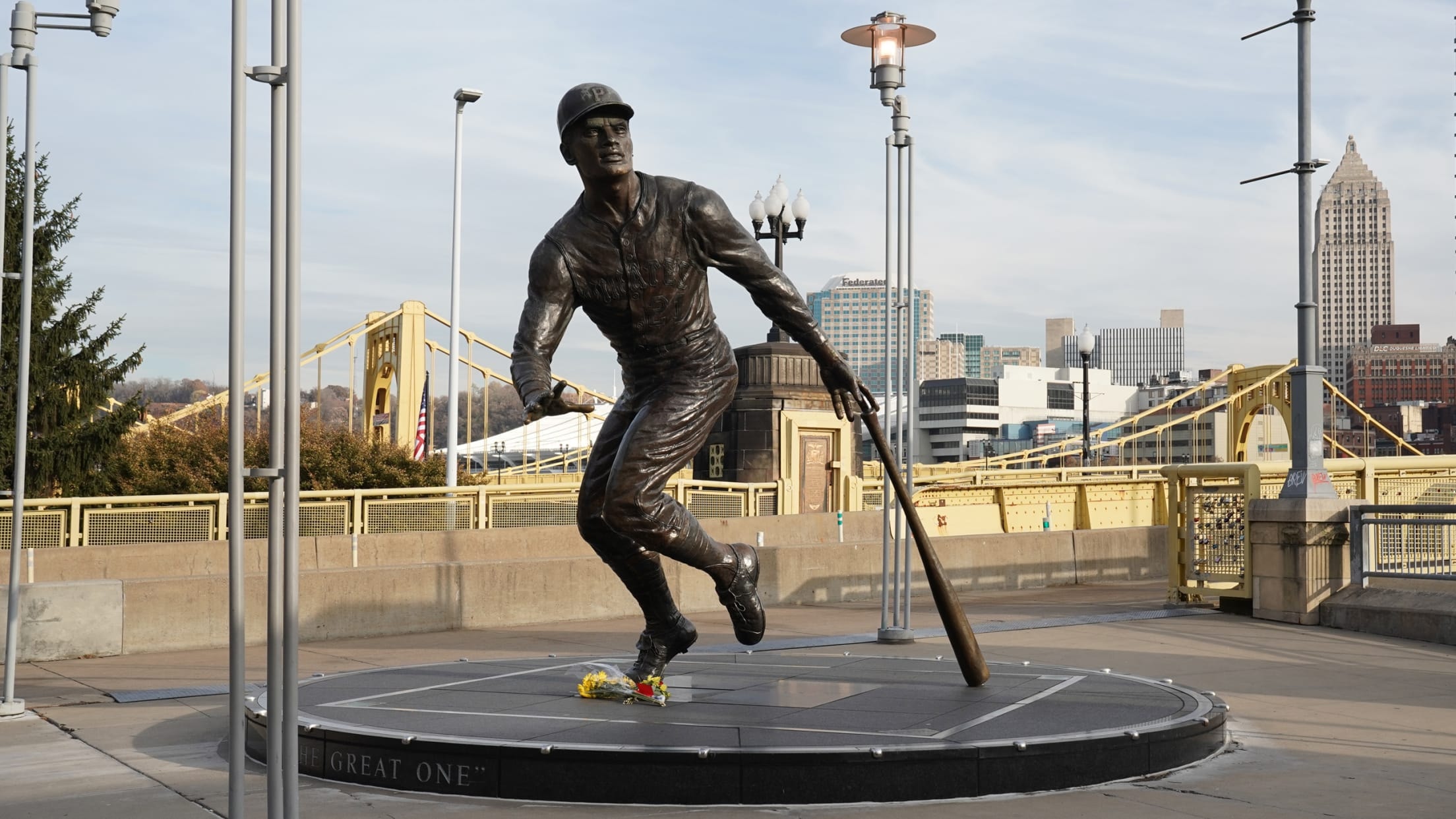 The Roberto Clemente statue outside PNC Park with Pittsburgh skyline behind it