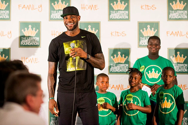 LeBron James with children at a LeBron James Family Foundation I PROMISE event